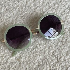 Jade-green round lens sunnies. Gold-tone hardware.
